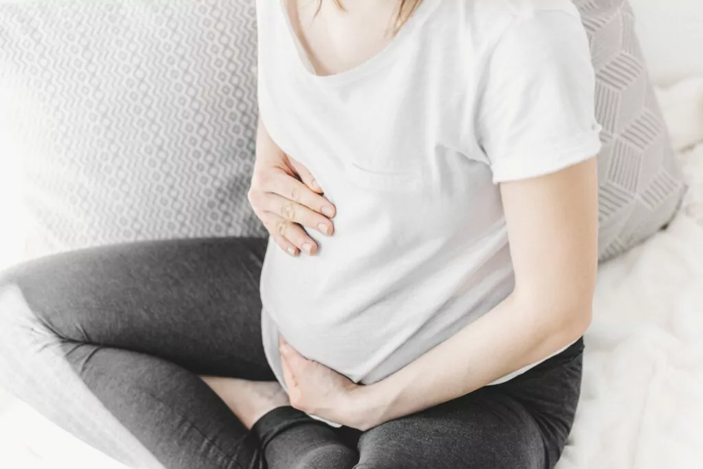 Young Pregnant Woman Touching Her Belly Min 1024x683.Jpg